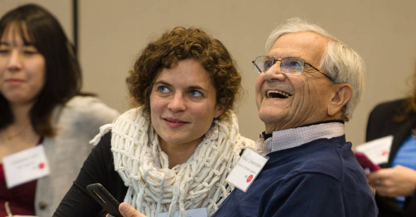 An older man and a woman sitting together at an Agelab event