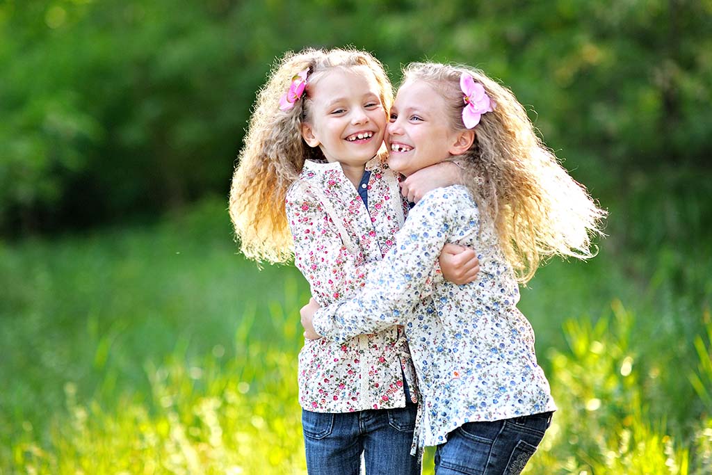 Portrait of two little girl twins