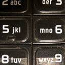 Way too close to the grubby keypad of my old Nokia. Centred in the frame are the five and the six.