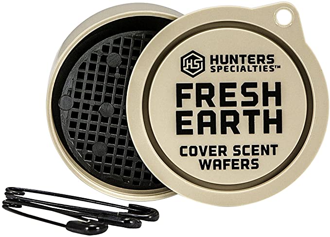 A case of scent cover wafers lays open on display with two paperclips in front of it. It'll help aspiring deer bow hunters cover their scent.