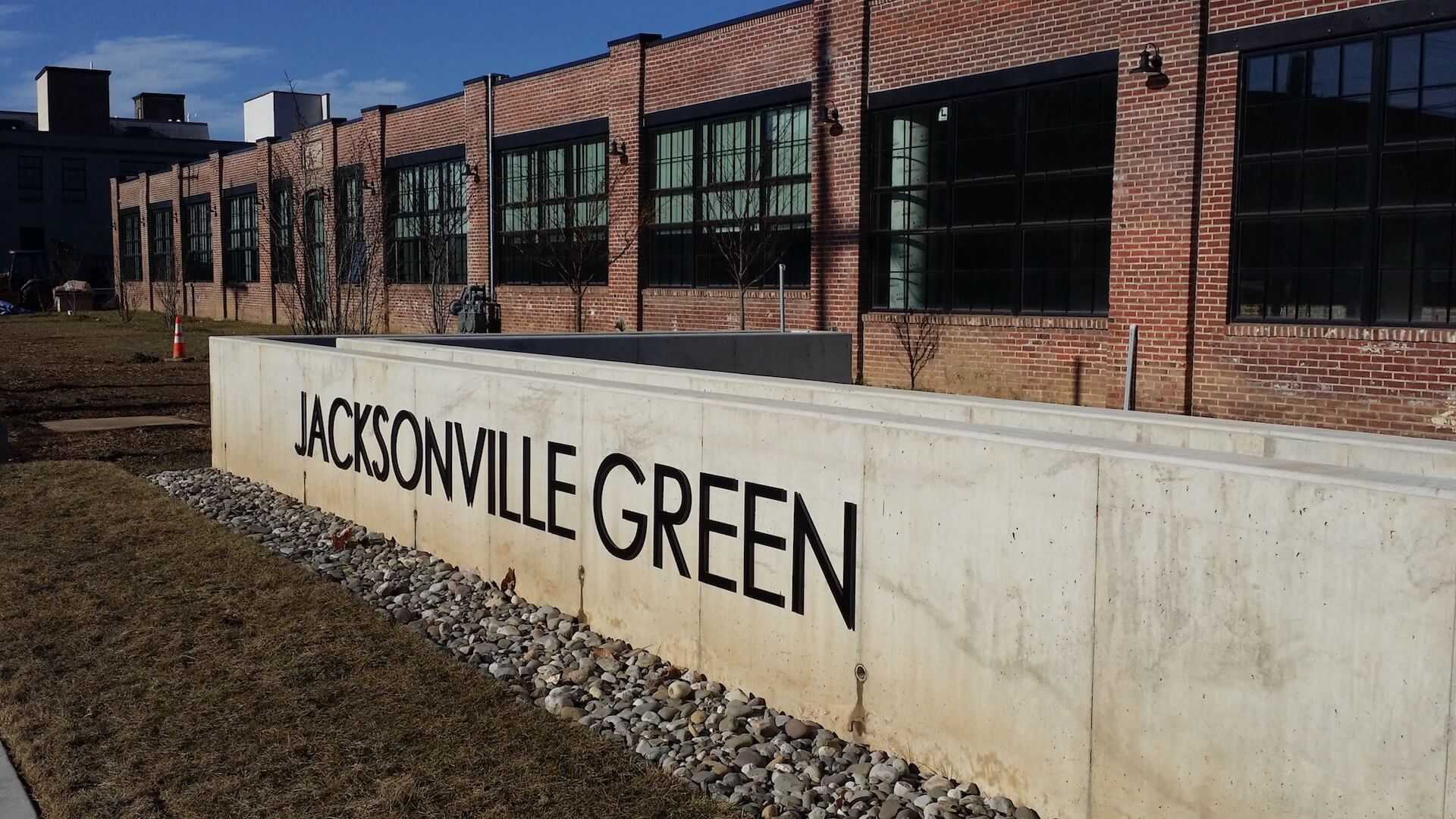 long concrete wall with Jacksonville Green on it