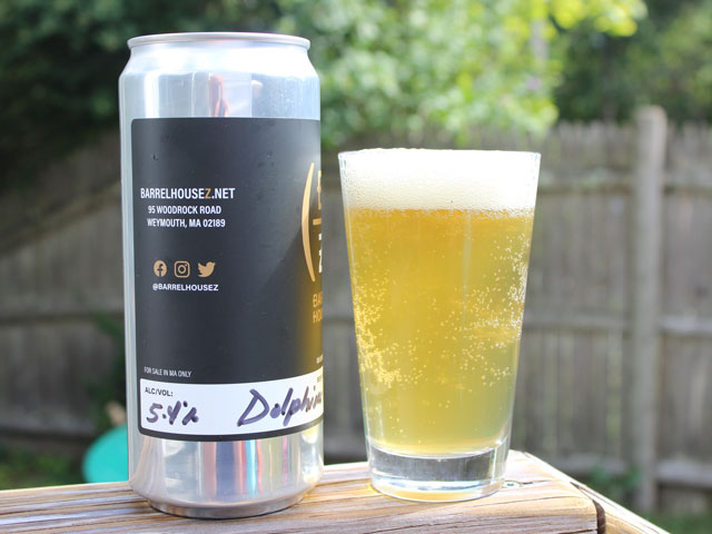 A 32oz crowler of Dolphins on Parade poured into a pint glass