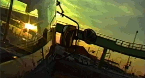 An animated gif from the movie 'Vibrator' showing the view of a camera attached to the outside of a semitruck as it drives during a sunset.
