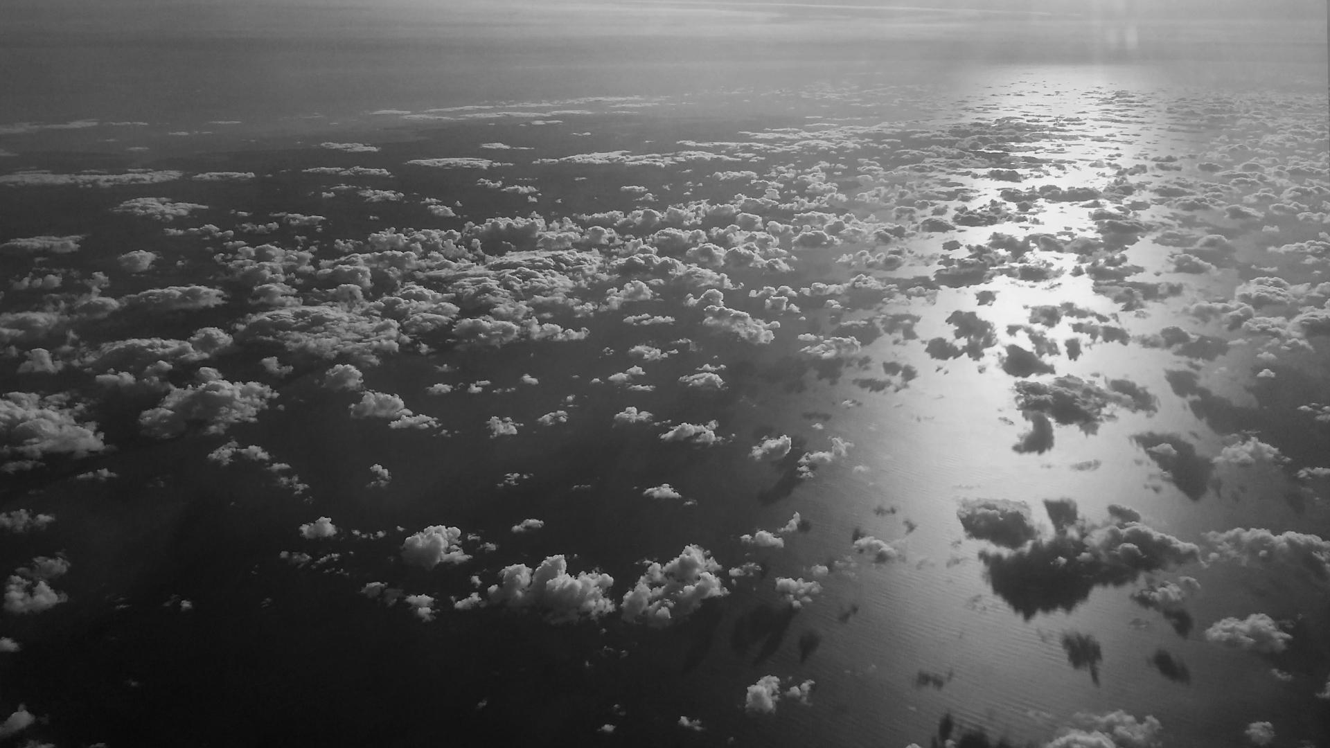 A black and white photo of clouds over the Irish Sea by Adam Westbrook