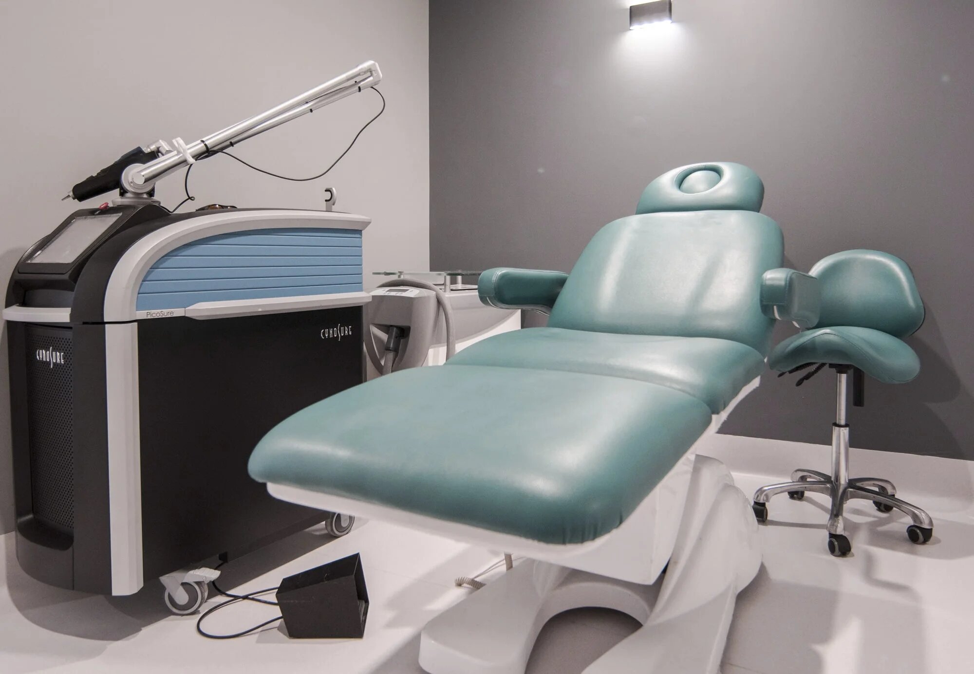 Picosure machine placed alongside patient chair in 99 Medispa clinic room
