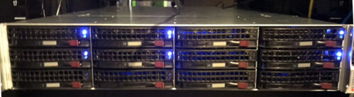 Photo of the server, fully assembled and running in a server rack.