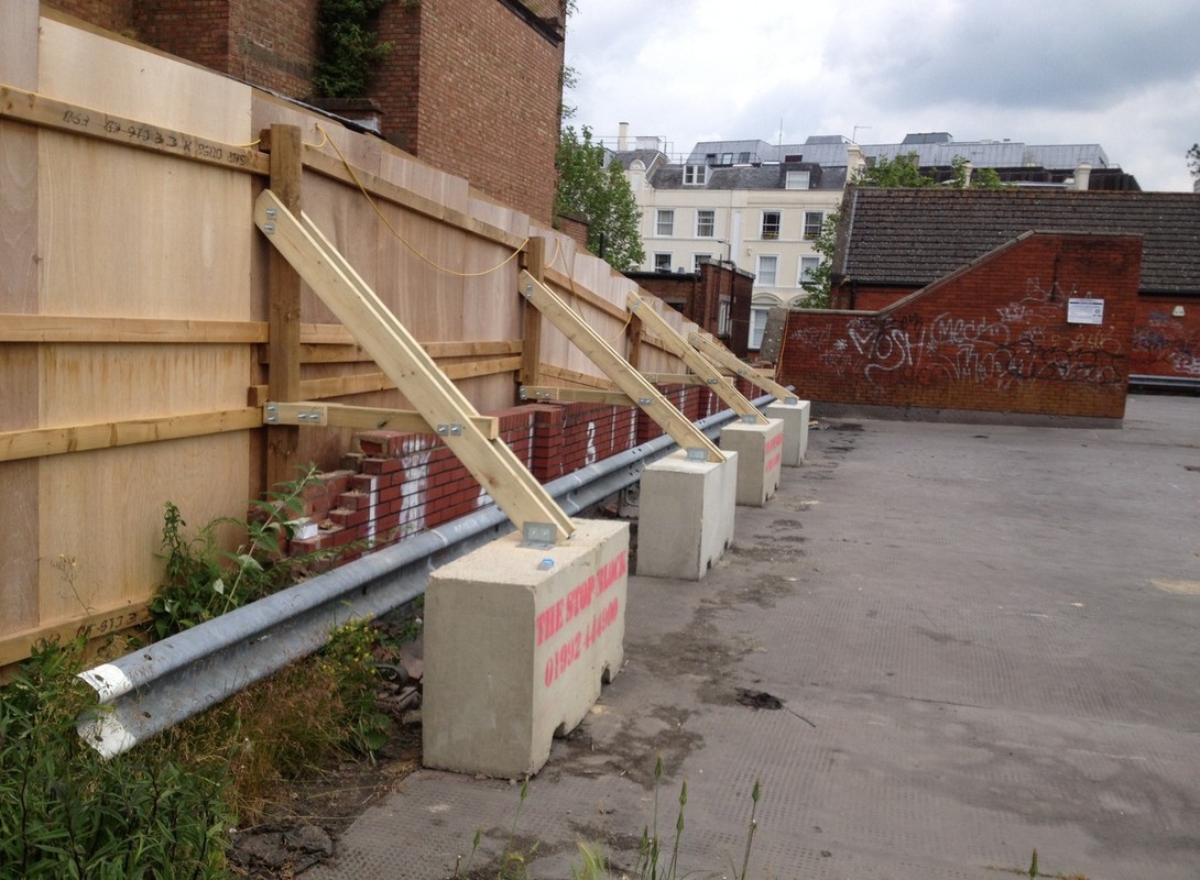 free-standing timber hoarding with supports