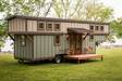 Timbercraft Tiny Homes' Retreat gooseneck tiny house; another exterior photo showing the home from another angle Timbercraft Tiny Homes' Retreat gooseneck tiny house; another exterior photo showing the home from another angle