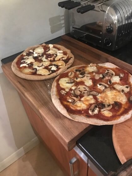 Pizzas ready for slicing