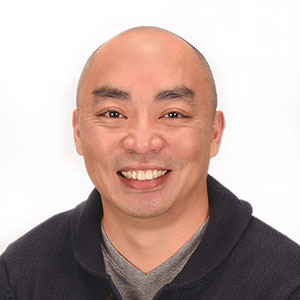 headshot of Insight Creative's Front-End Web Developer, Chue Vang