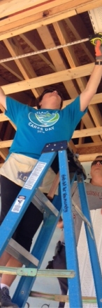 Atlantic Bay employee volunteers on RocSolid playset build