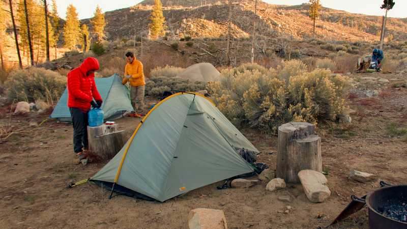 Taking down tents at Little Bear Springs Camp