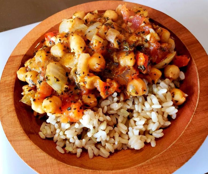 Bowl of chickpea curry over brown rice