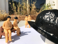 Plastic figures in bowler hats