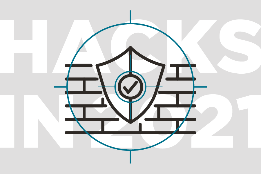 A security shield in front of a wall signifying a firewall and security.