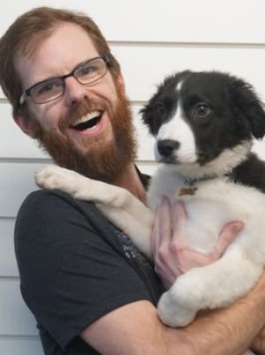Matthew Hebert with his dog, Logan.