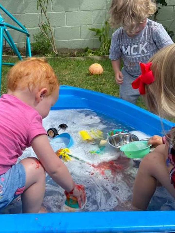 Playing in the paddling pool