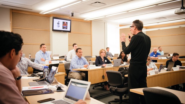 Photograph of SMU Cox faculty teaching a class
