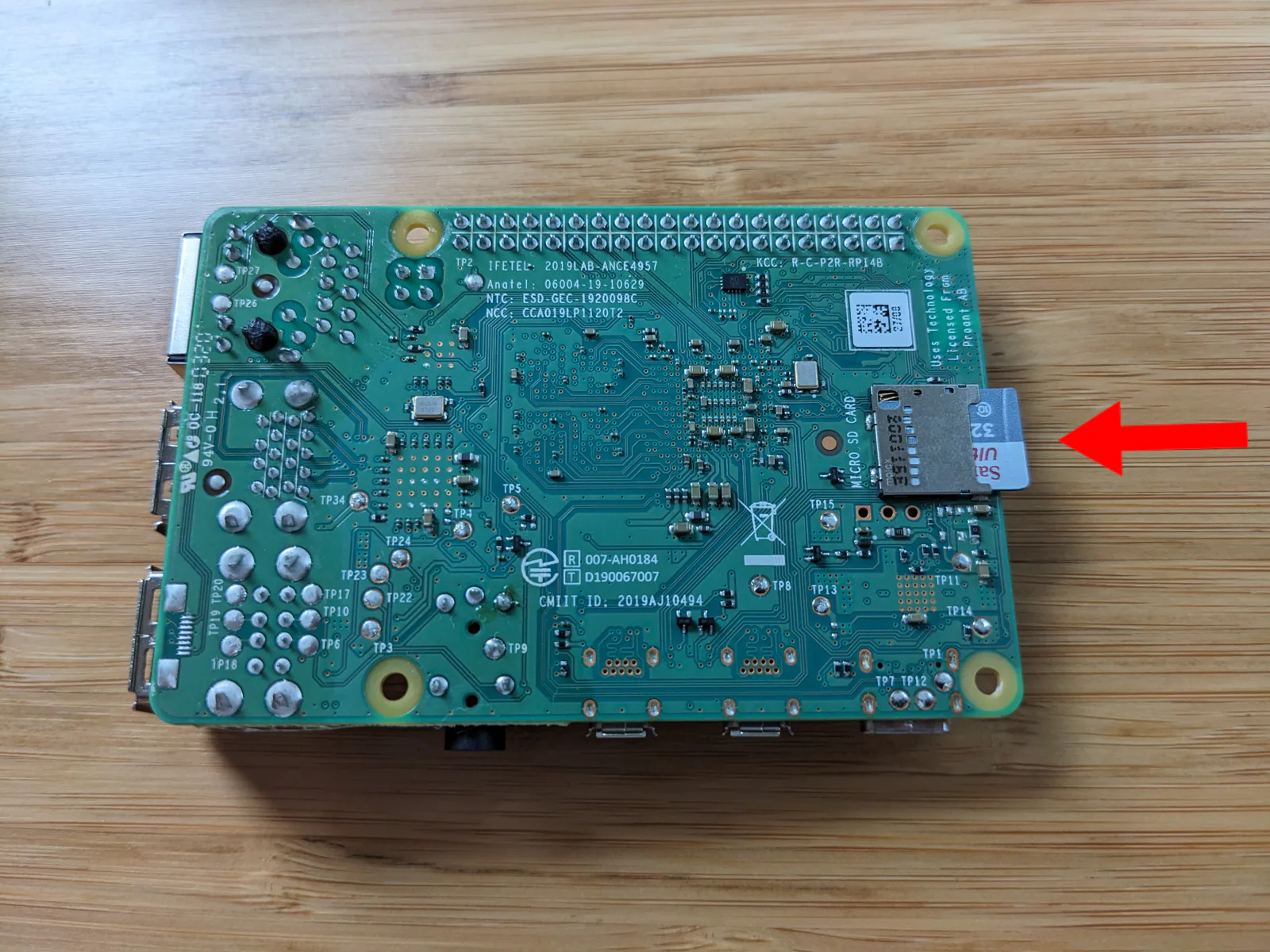 Photo of microSD inserted into microSD slot of Raspberry Pi