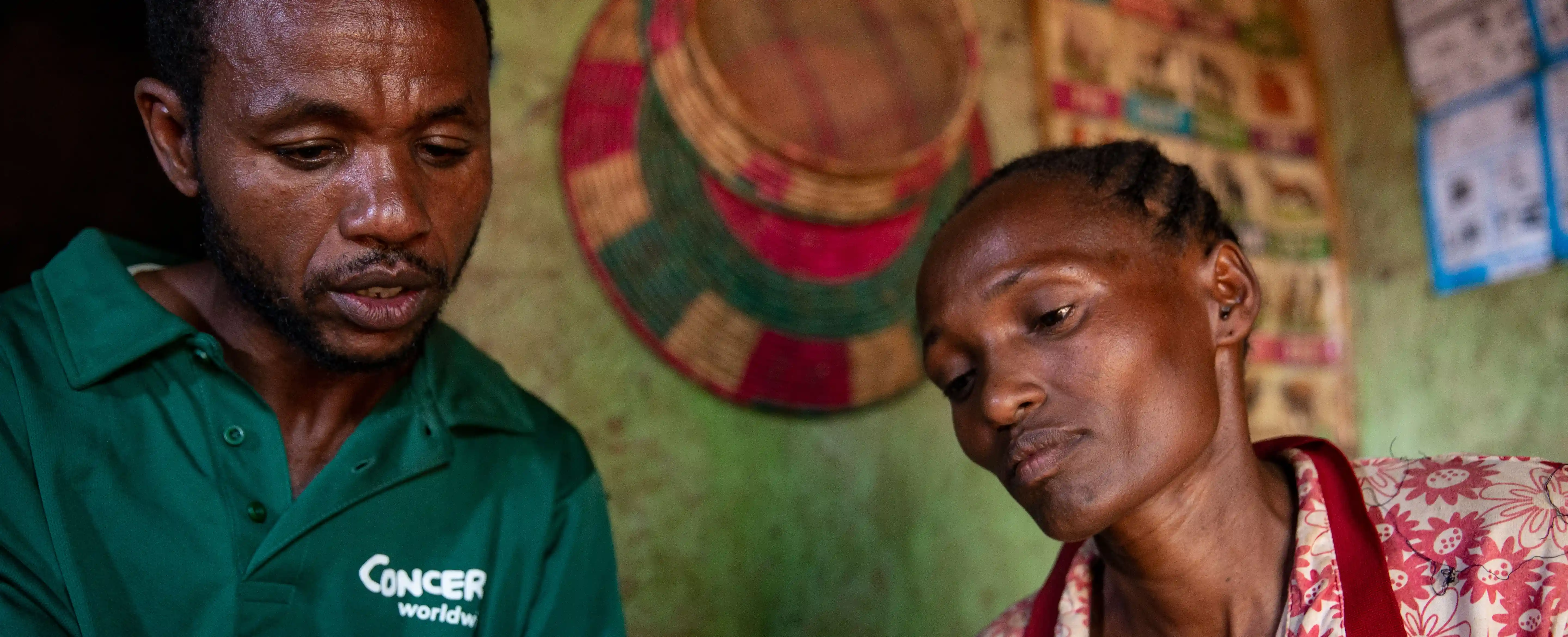 Tarkuwa Debsa, with Concern community coordinator Abate Eyaso at her home in SNNPR, Ethiopia.