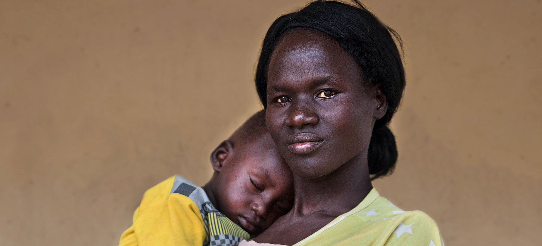 Nyadiu* (28) with her youngest son, Kowey* (1 year and 9 months) outside of a maternal and child health clinic in war-torn South Sudan. (Photo: Abbie Trayler-Smith)