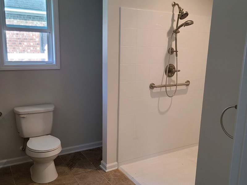 bathroom toilet and walk-in shower after a remodel by CorHome