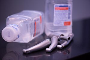 A close-up of a number of dental instruments and two bottles of liquid at Glenbrook Dental