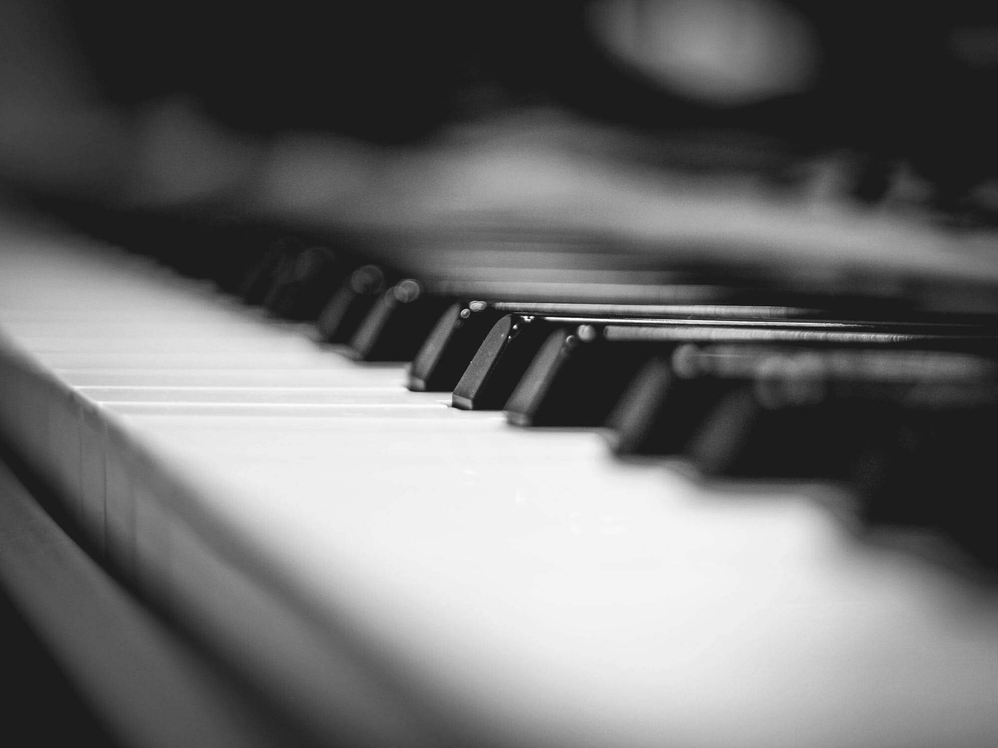 close up of piano keys in grayscale