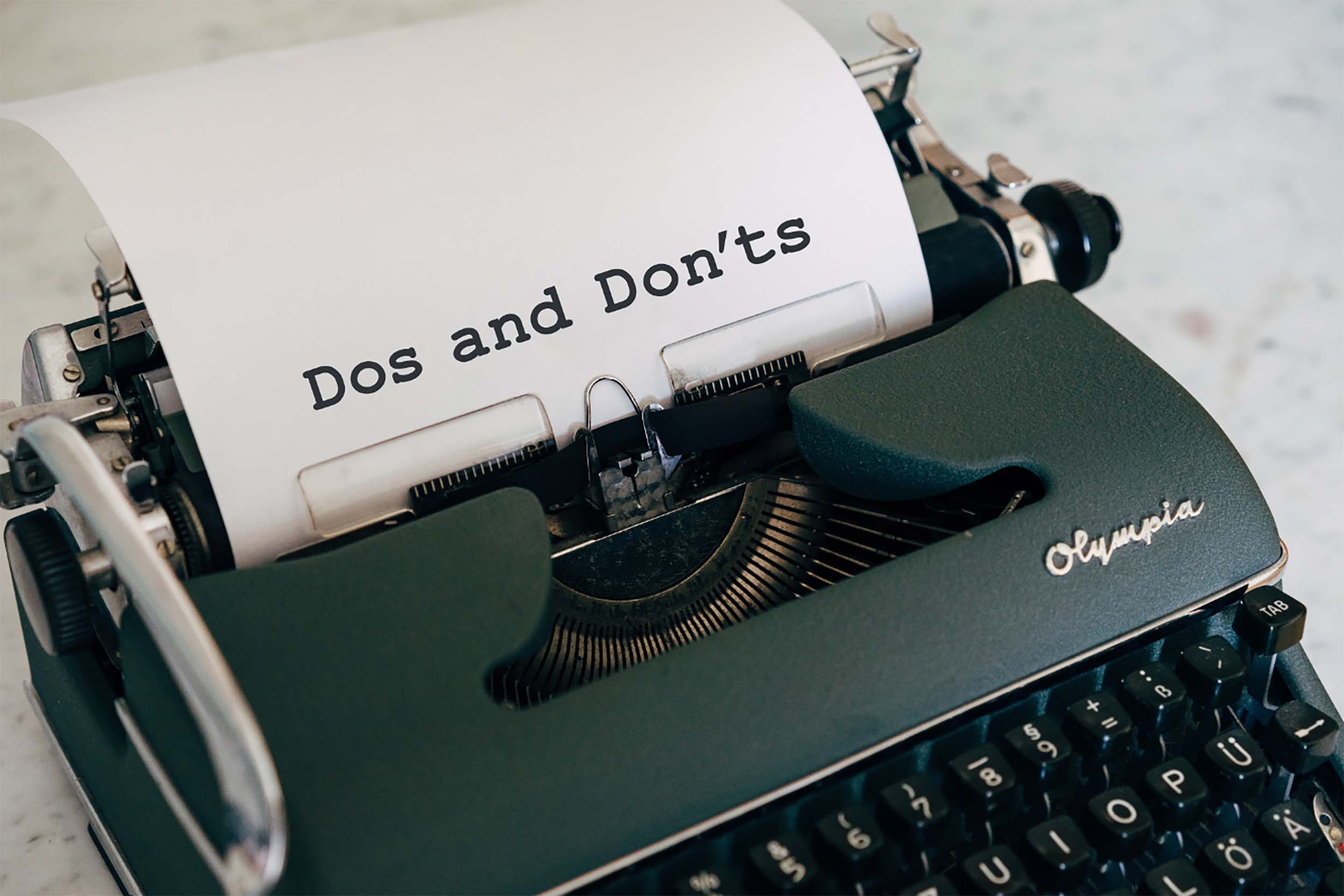 Typewriter with Do's and Don'ts title typed out on a piece of paper