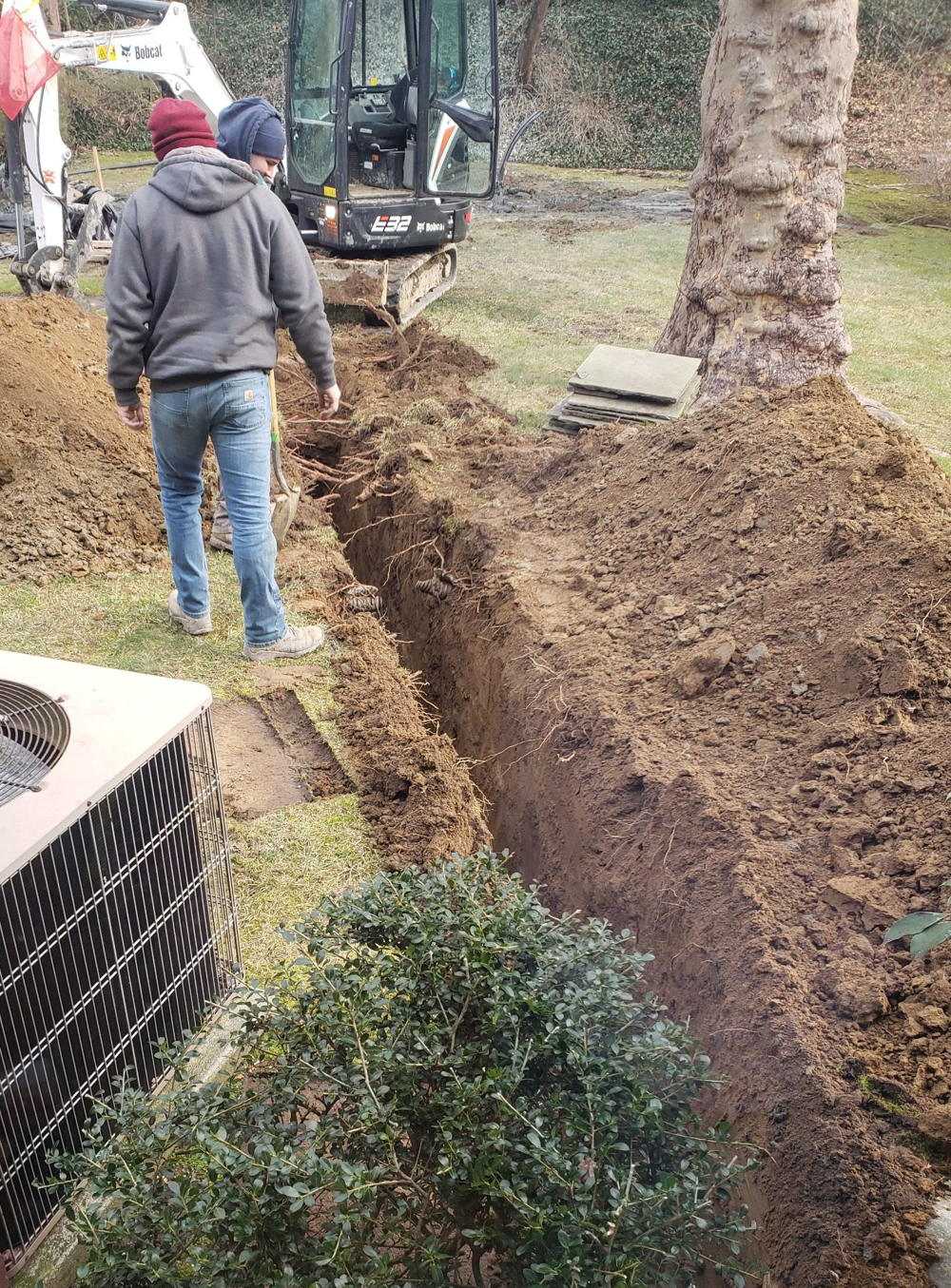 Dandelion crew digging the trench for our closed loop geothermal heating system