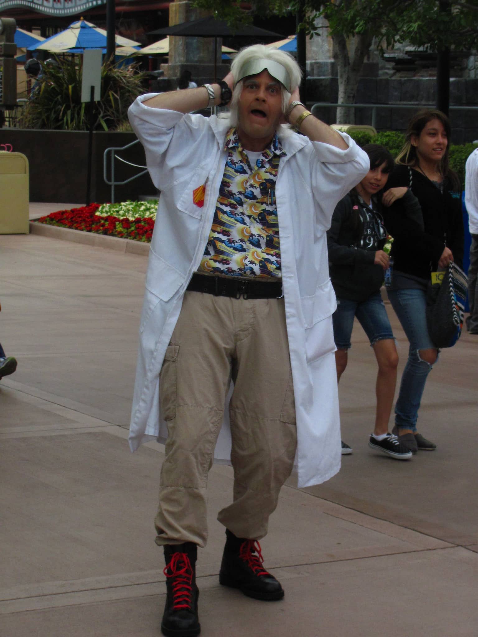 a man dressed as doc brown from the movie Back to the Future with a quizzical expression