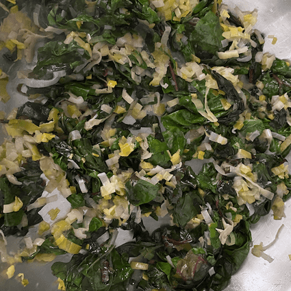 Add the chard to the pan and cook until wilted, another 5 minutes. Allow to cool slightly before mixing with the eggs.