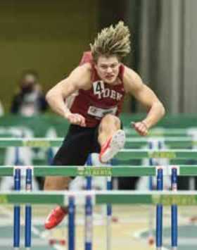 Kayden Johnson jumping hurdles at indoor track field Kayden Johnson jumping hurdles at indoor track field