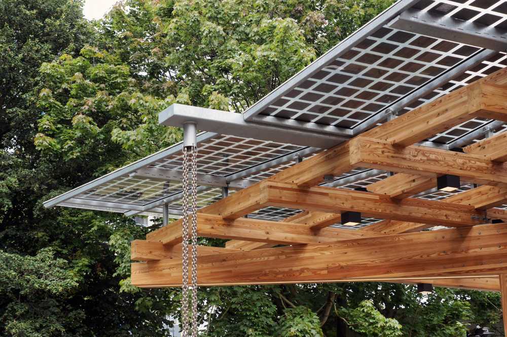 Detail of the K:Port timber structure, photovoltaic panels and rain water drainage chains