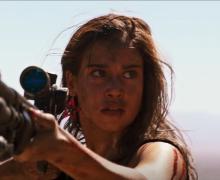 Jen (Matilda Lutz) stalks one of the men who did her wrong on a desolate desert road.