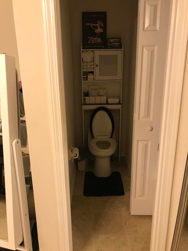 toilet in a small inaccessible space before a remodel by CorHome