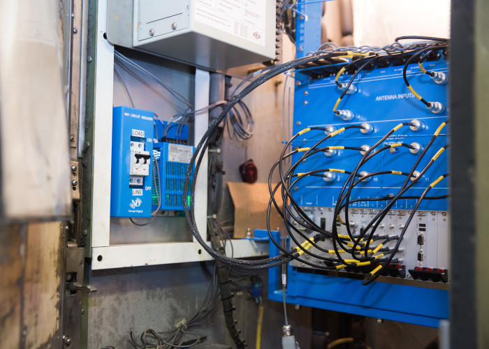 blue 4G radios with cabling in train