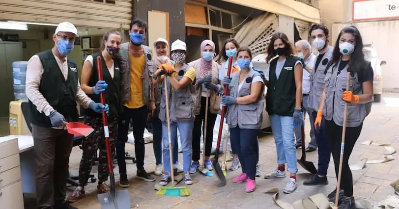 A group of aid workers responding to the explosion in Beirut with cleanup efforts.