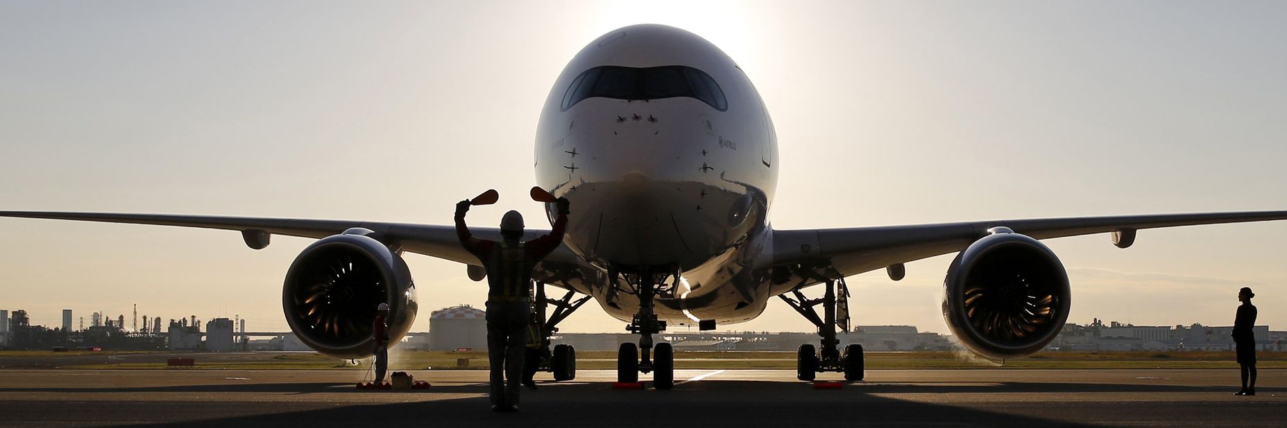Charter aircraft arriving at airport stand