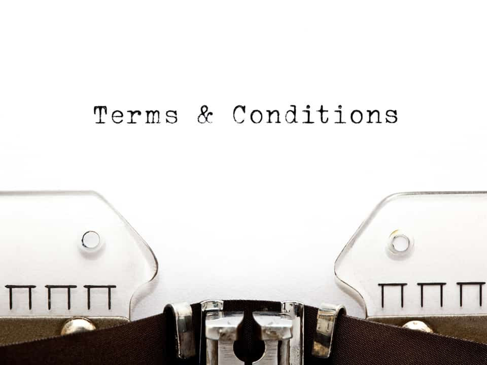 terms and conditions document being held on two hands