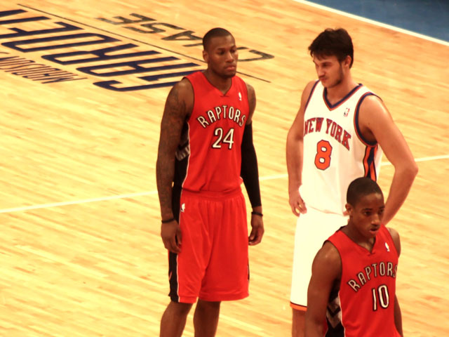 Two players on the Toronto Raptors NBA team on the court