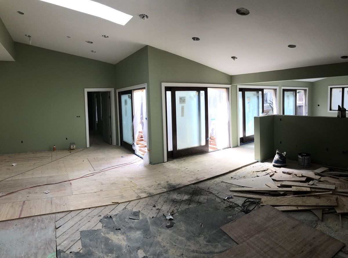 enlarged photo of green painted walls of an in-progress interior home painting job