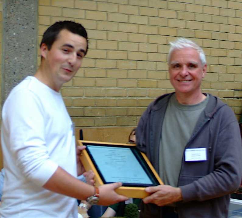 Tom Dauben is presented the 2009 Reinier Hendriksen Trophy by Chris O'Donoghue