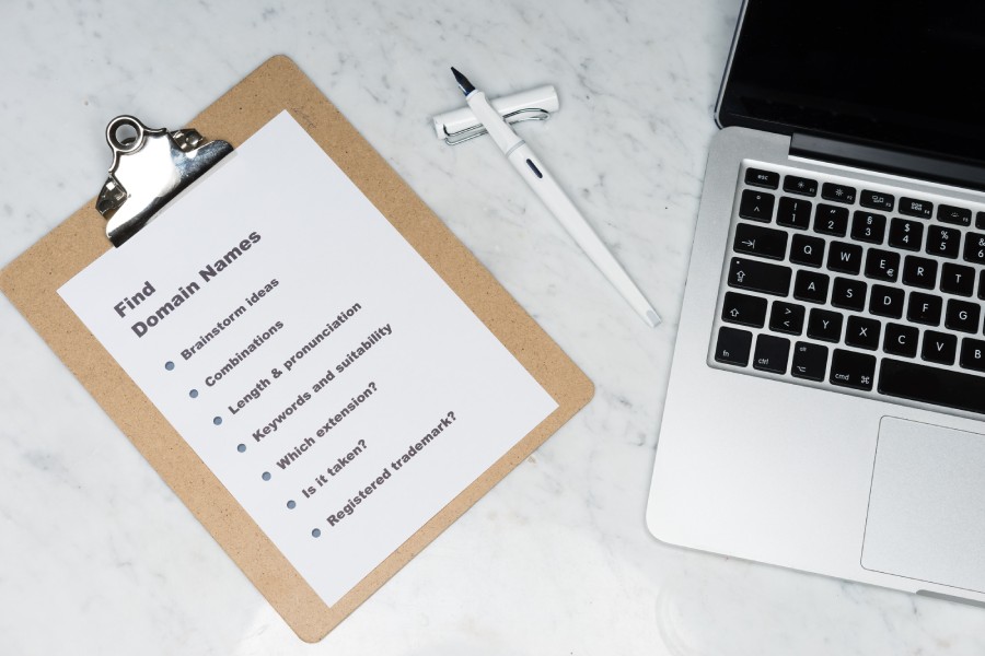 checklist on a clipboard for the different questions to ask when getting a new website domain