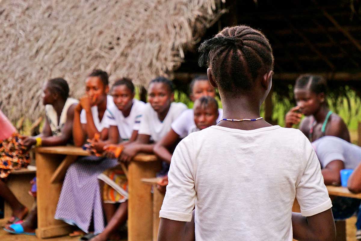 Participants listen during a Life Skills session as part of the IAPF integrated program in Sierra Leone