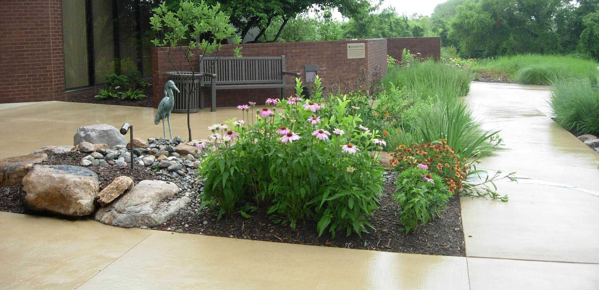 flower bed with crane statue