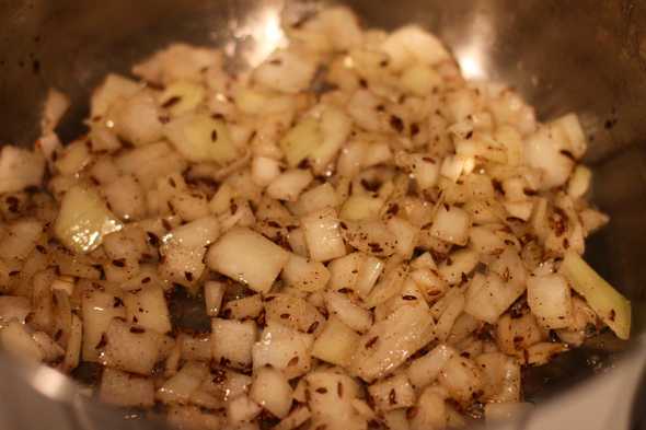 Cumin seeds and onions cooking