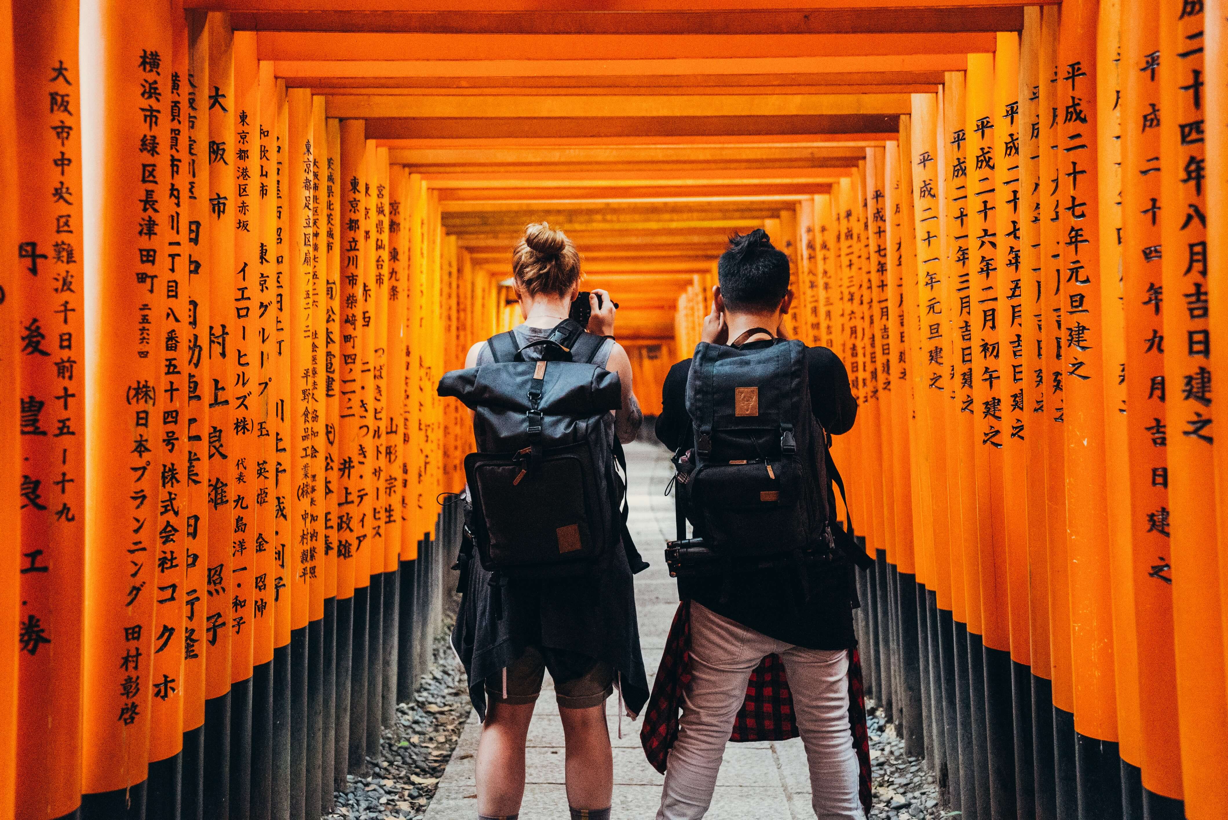 Walking Through Torii Gates In Japan