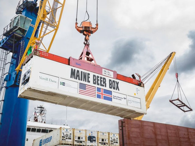 The Maine Beer Box being loaded onto a ship