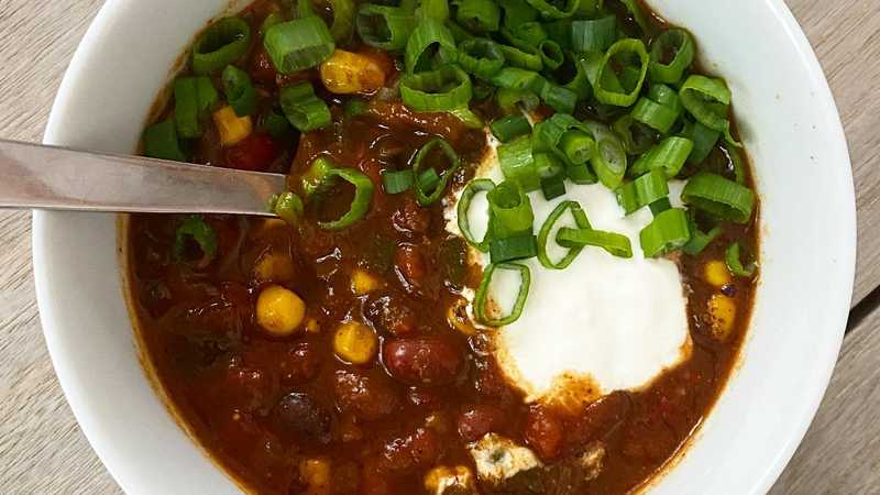 photo of completed recipe: Vegan chili that’s just as good as meat chili. This one uses 3 types of fresh peppers and beans and corn to give it enough body to make it feel hearty…